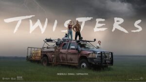 "Dramatic movie scene from Twisters showing two characters standing atop a rugged storm-chasing vehicle in a vast open field, with dark storm clouds gathering in the background and the movie title 'Twisters' displayed above.