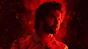 Saripodhaa Sanivaaram in a dramatic red-hued scene symbolizing tension.