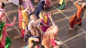 "Punjabi women dancing in celebration, scene from Amar Singh Chamkila