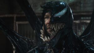 Venom bares his fangs in a menacing close-up from Venom: The Last Dance, highlighting the symbiote's raw power.