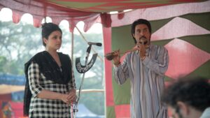 "Amar Singh Chamkila performing with a female singer on stage